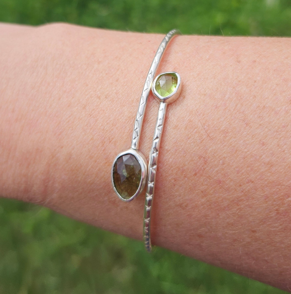 Sterling silver bangle with moldavite and peridot