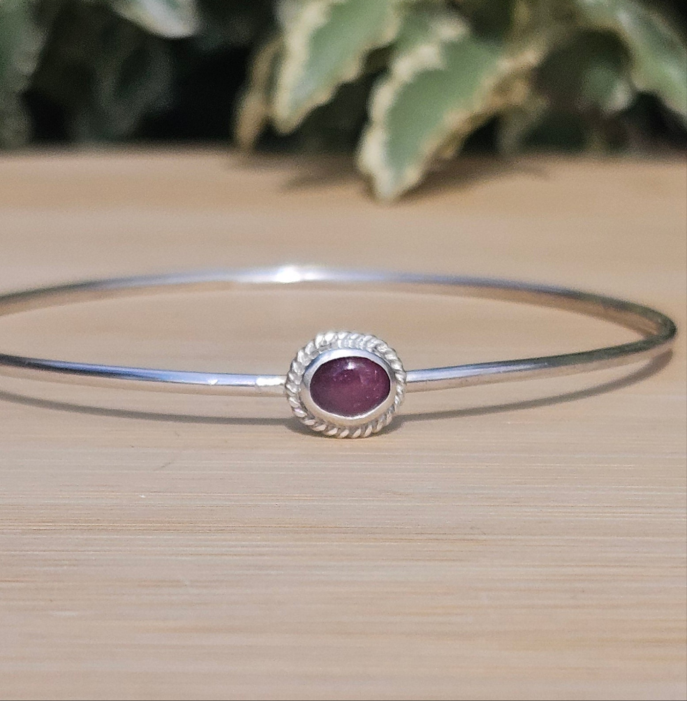Sterling silver bangle with a tourmaline
