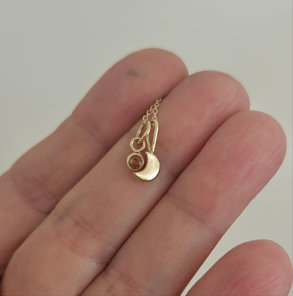 Moon and sapphire pendant