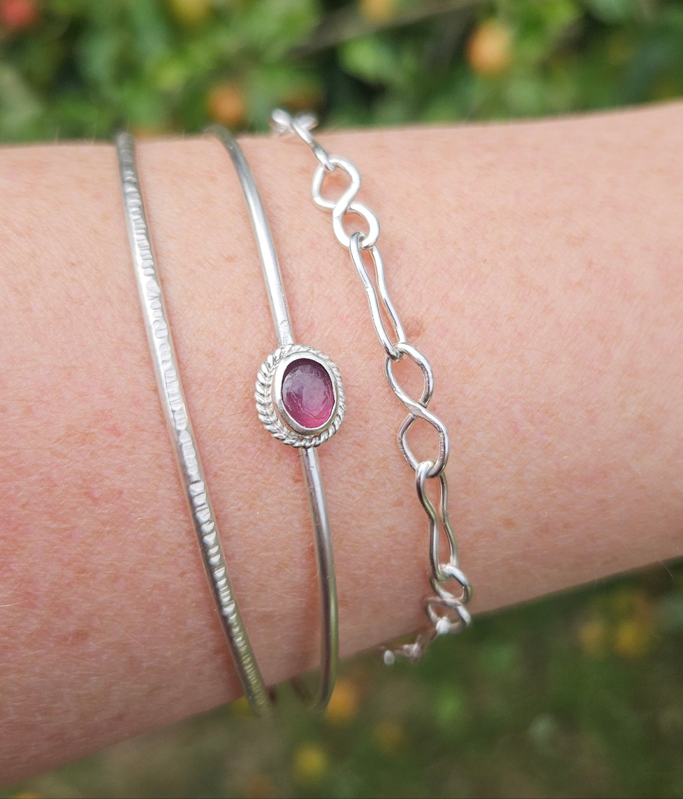 Sterling silver bangle with a tourmaline
