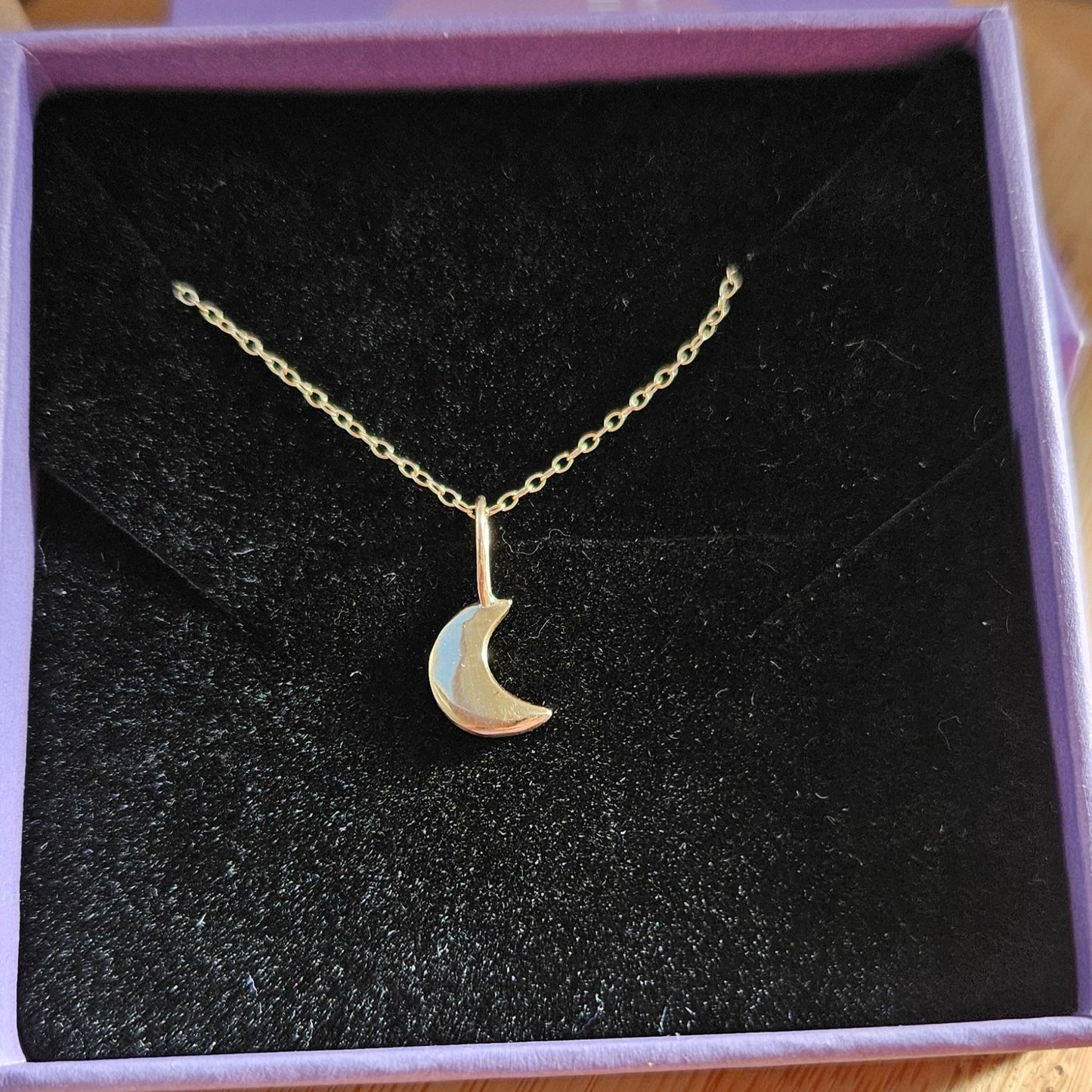 Gold moon pendant