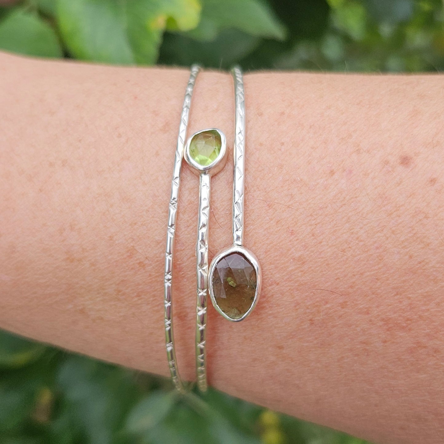 Sterling silver bangle with moldavite and peridot