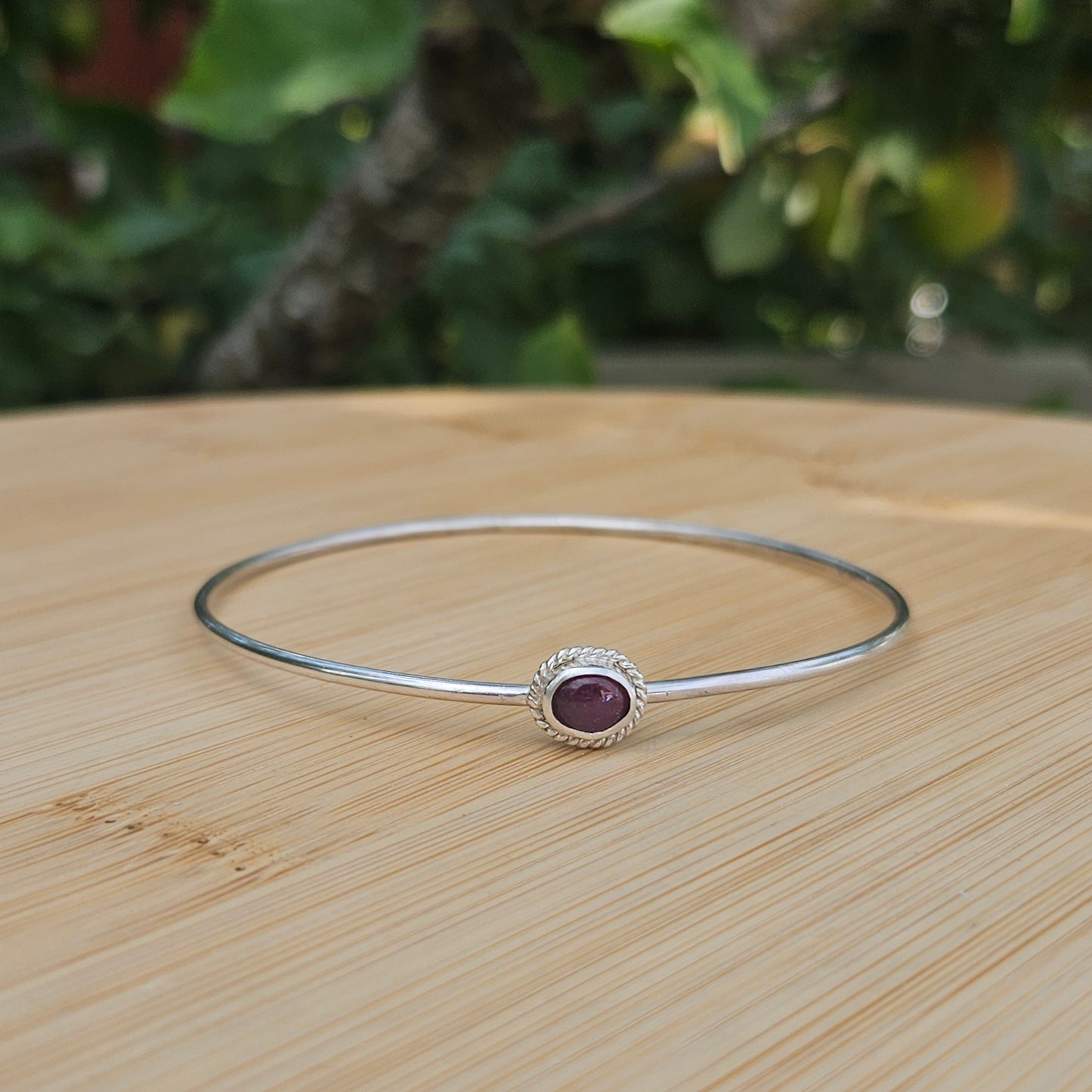Sterling silver bangle with a tourmaline