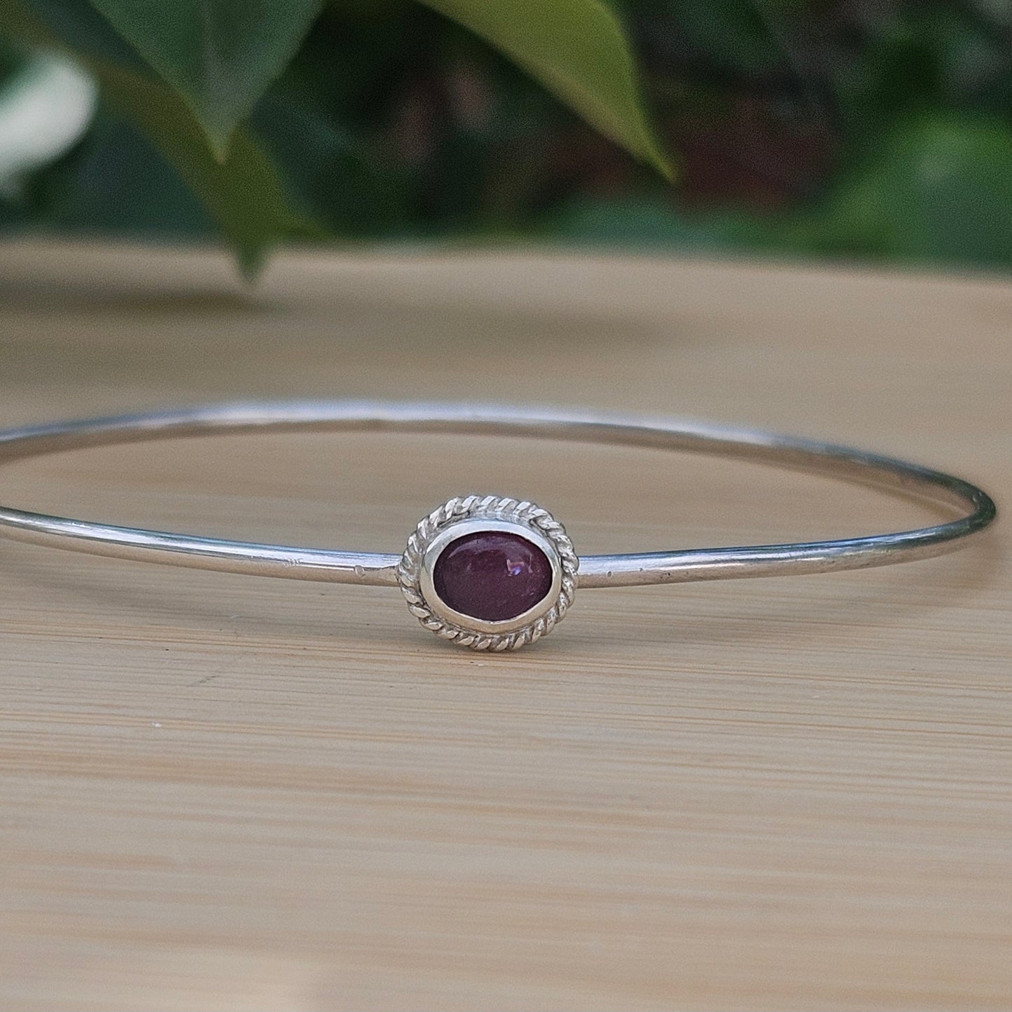 Sterling silver bangle with a tourmaline
