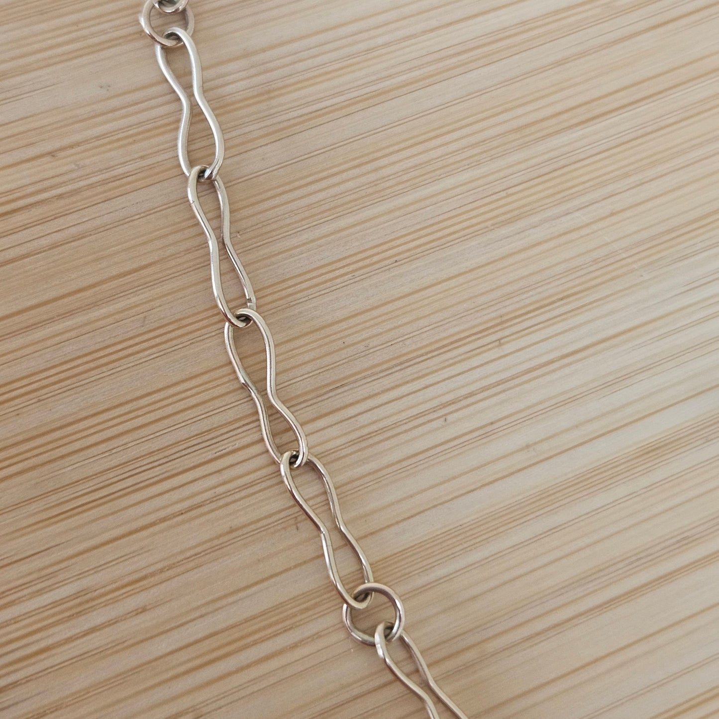 9ct handmade gold chain with a sapphire charm