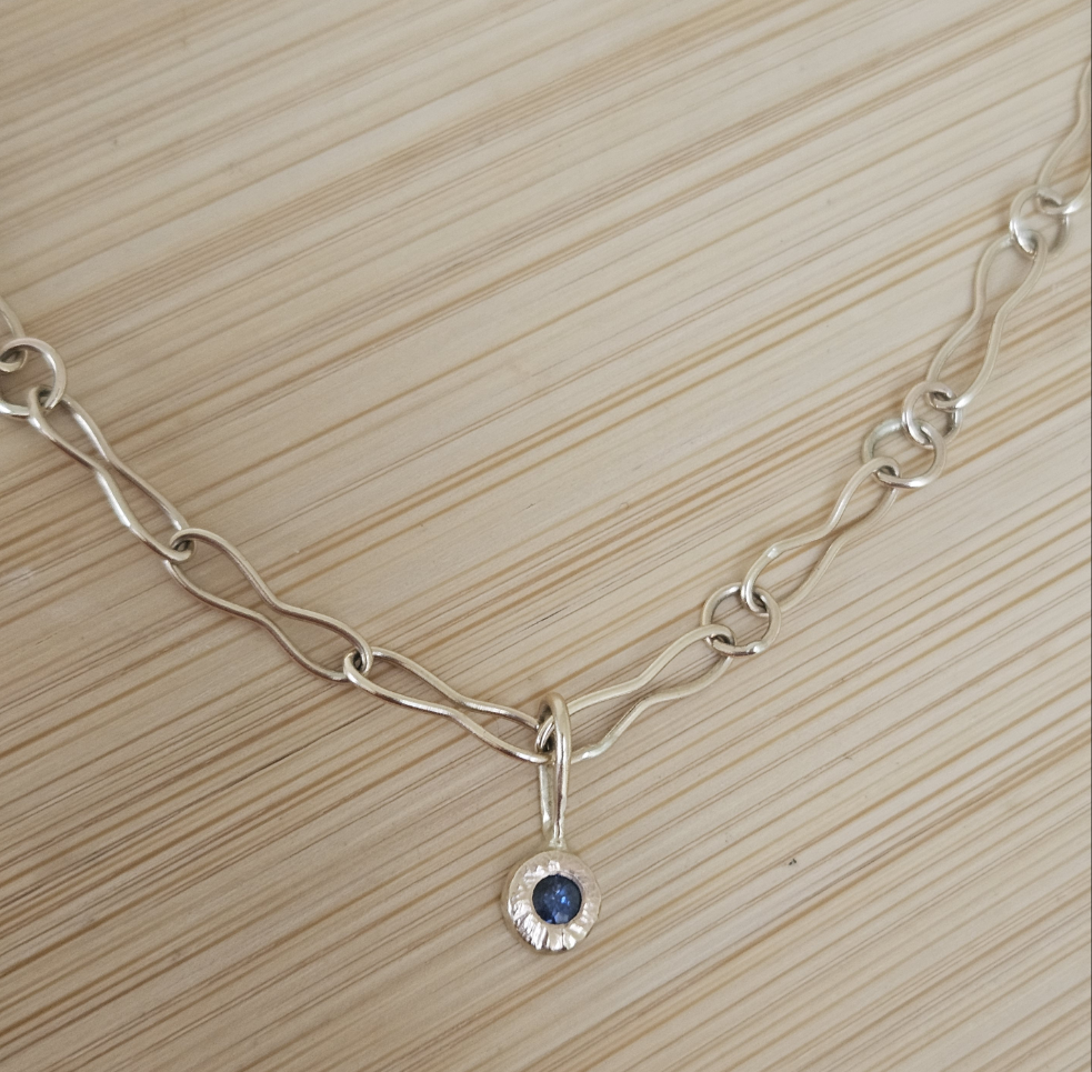 9ct handmade gold chain with a sapphire charm