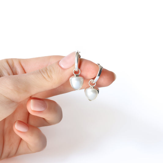 Pearl huggie earrings in sterling silver