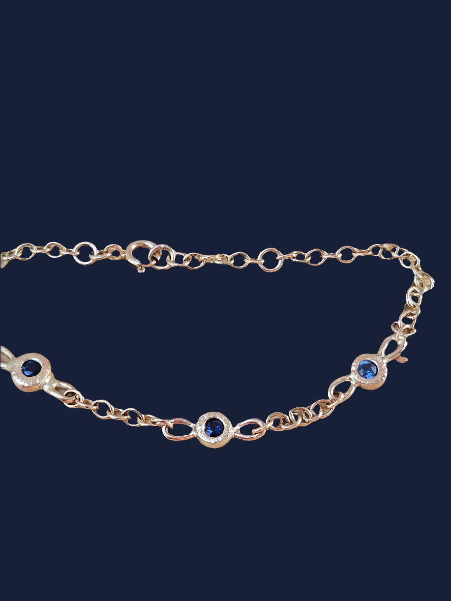 9 ct gold bracelet with blue sapphires