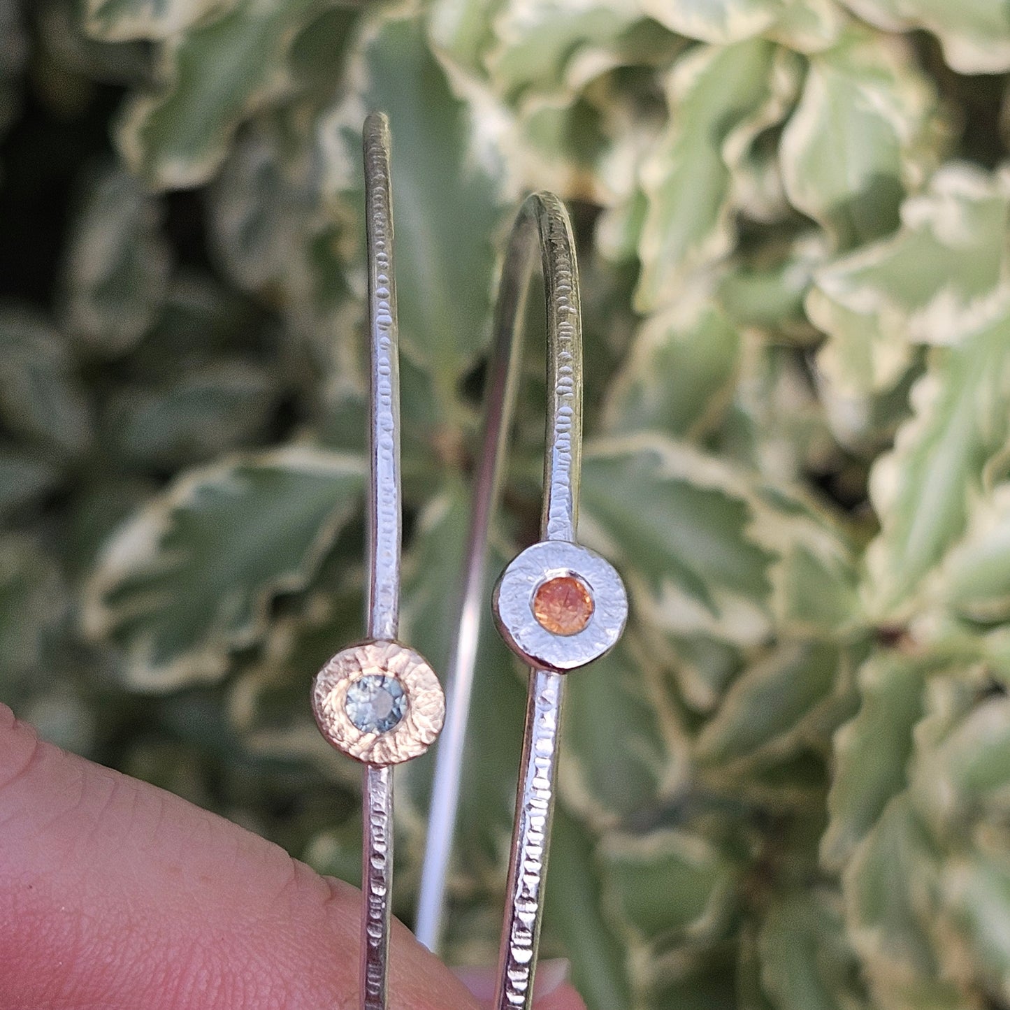 Silver bangle with sapphire