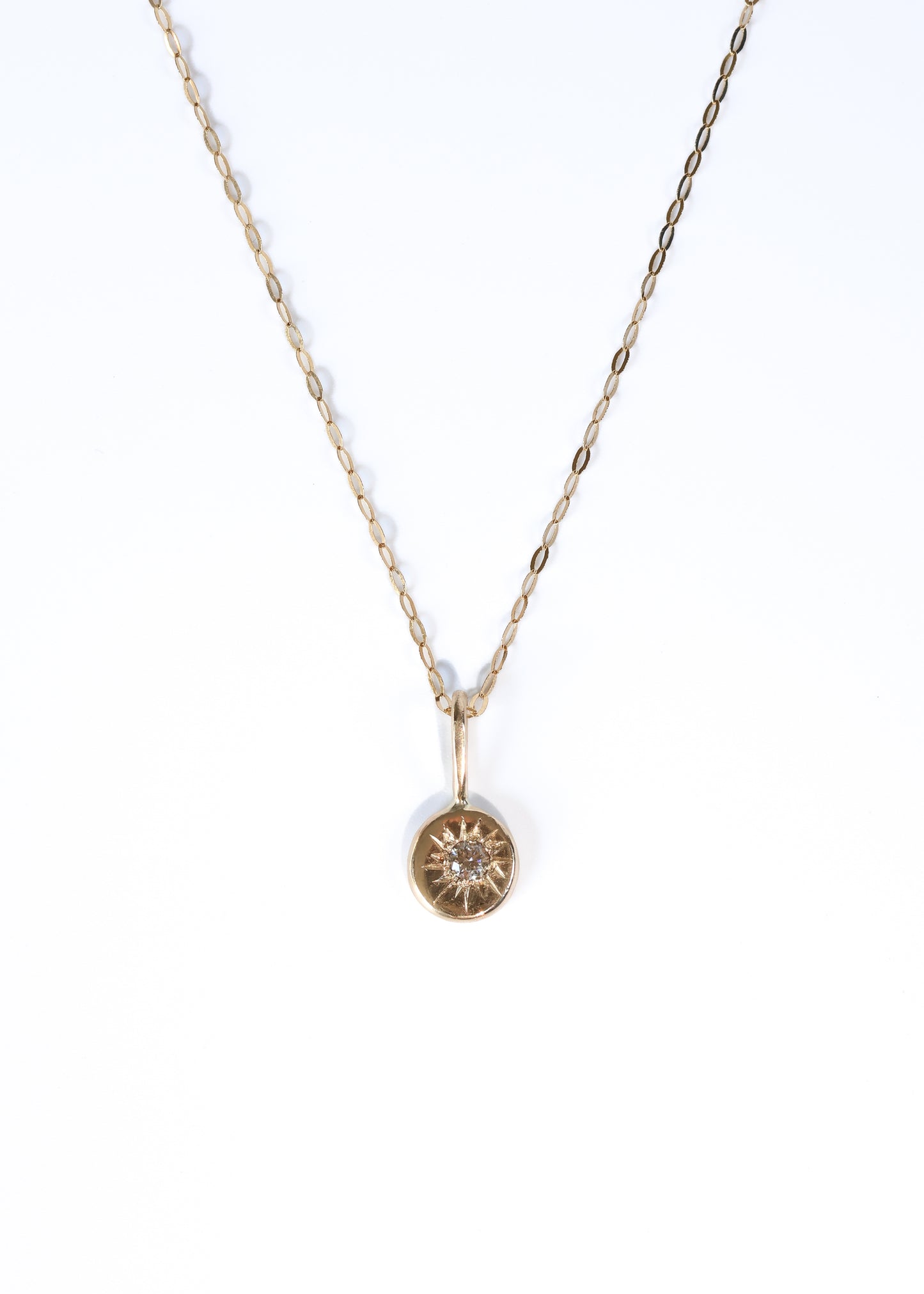 9ct gold organic shape pendant with diamond