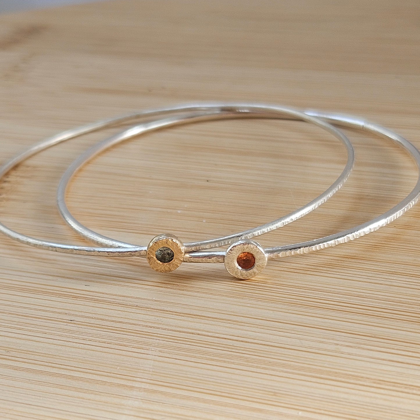 Silver bangle with sapphire