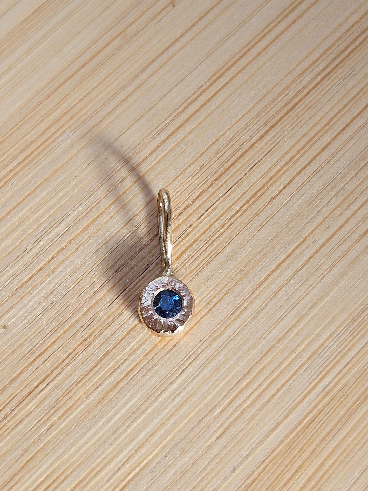 Sapphire hammered charm