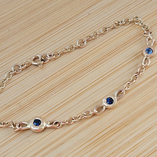 9 ct gold bracelet with blue sapphires