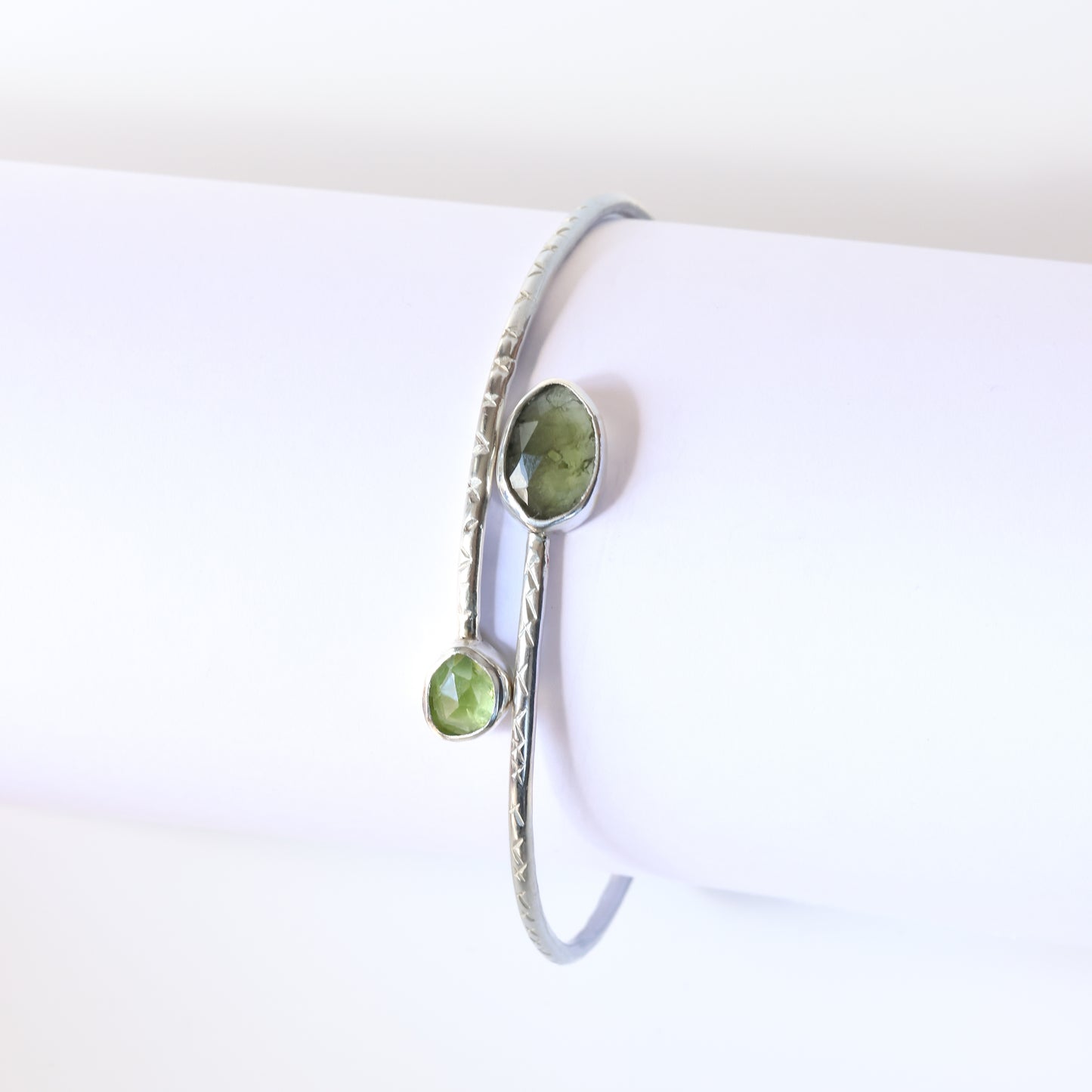 Sterling silver bangle with  moldavite and peridot